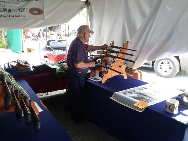 A visitor peruses the &quot;Member guns for sale&quot; rack